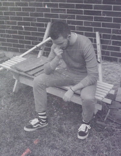Black & White photo of Borrtex as he is sitting on the bench and thinking.